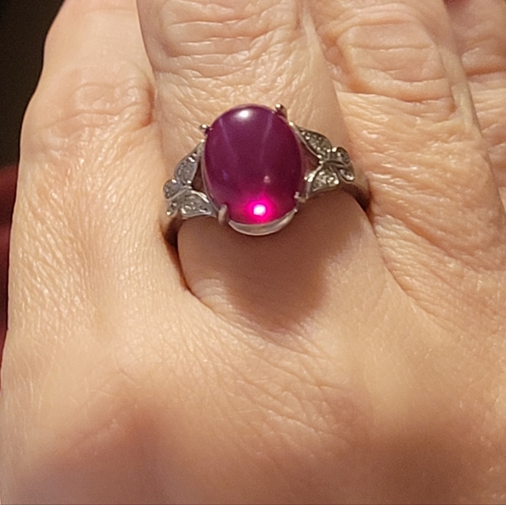 Stamped! 925 sterling with 10x12 Star ruby. Adjustable size.